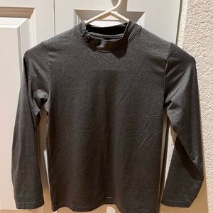 Like new, long sleeve all season size 6 boys UA dri-fit shirt